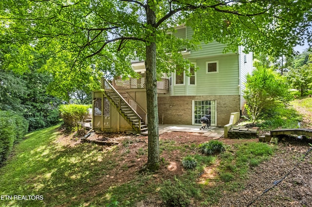 1312 Zachary Taylor Rd, Knoxville, TN 37922 - rear view of property featuring stairs, a patio area, and a deck