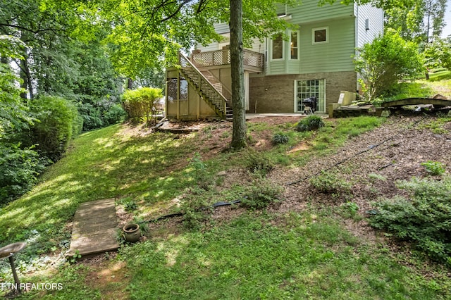 1312 Zachary Taylor Rd, Knoxville, TN 37922 - view of grassy yard with stairway and a deck