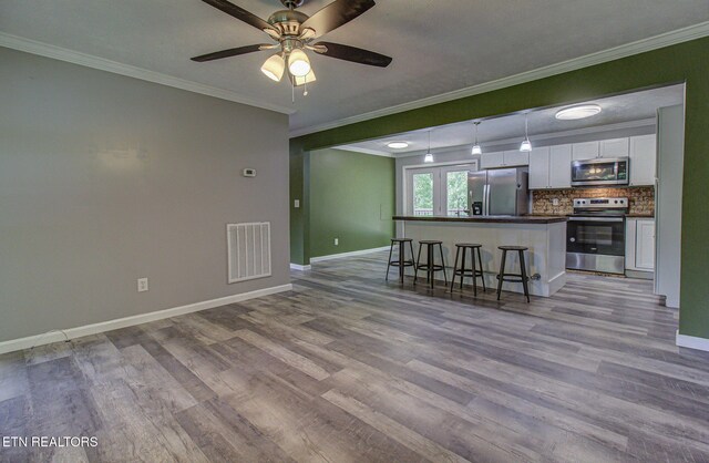 775 Middle Creek Rd, Cosby, TN 37722 - living room featuring ornamental molding, light wood finished floors, and a ceiling fan