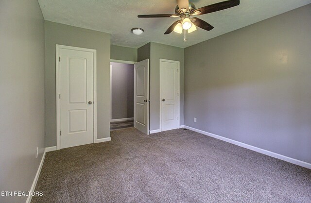 775 Middle Creek Rd, Cosby, TN 37722 - unfurnished bedroom with dark colored carpet and a ceiling fan