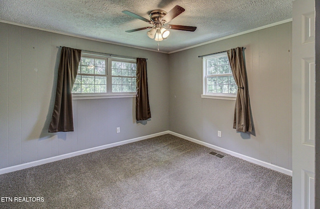 775 Middle Creek Rd, Cosby, TN 37722 - carpeted empty room with crown molding, a textured ceiling, ceiling fan, and wooden walls