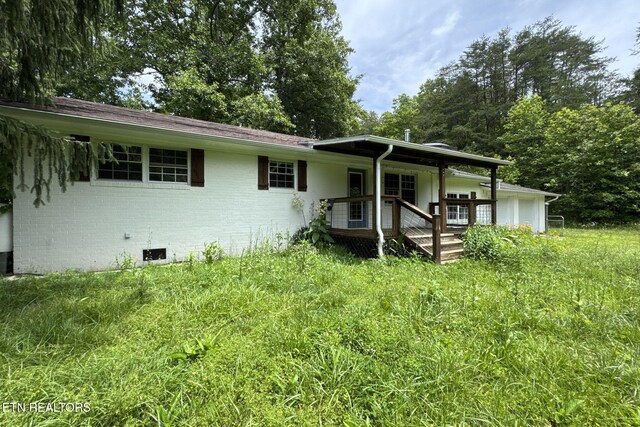 775 Middle Creek Rd, Cosby, TN 37722 - view of front facade featuring crawl space, brick siding, and a porch