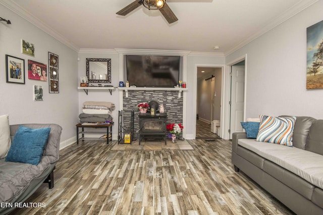 1246 Laurel Bluff Rd, Kingston, TN 37763 - living room with wood finished floors, a wood stove, crown molding, and ceiling fan