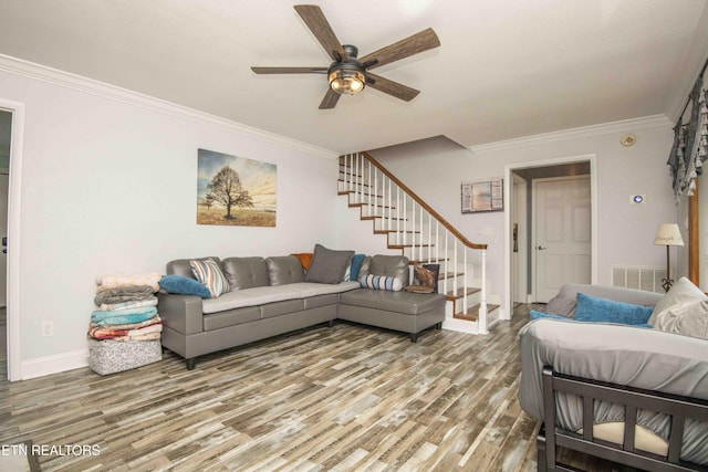 1246 Laurel Bluff Rd, Kingston, TN 37763 - living area featuring wood finished floors, ceiling fan, ornamental molding, and stairway