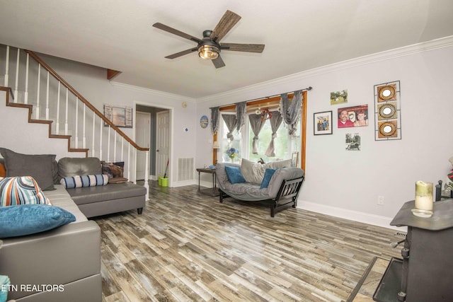 1246 Laurel Bluff Rd, Kingston, TN 37763 - living room featuring stairs, wood finished floors, ceiling fan, and crown molding