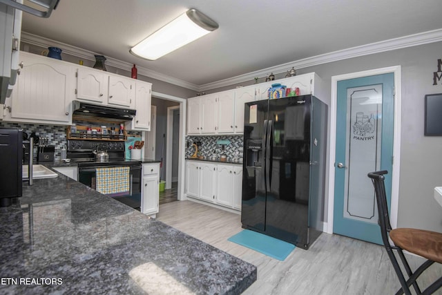 1246 Laurel Bluff Rd, Kingston, TN 37763 - kitchen featuring black appliances, under cabinet range hood, white cabinets, light wood-style floors, and ornamental molding
