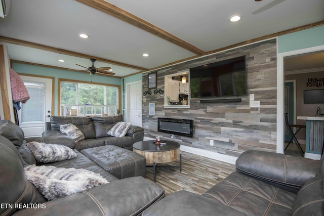1246 Laurel Bluff Rd, Kingston, TN 37763 - living room featuring ceiling fan, ornamental molding, an accent wall, recessed lighting, and wood finished floors