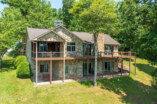 226 Mountain Crest Dr, Lafollette, TN 37766 - rear view of house with stone siding, a yard, a patio, a deck, and a chimney