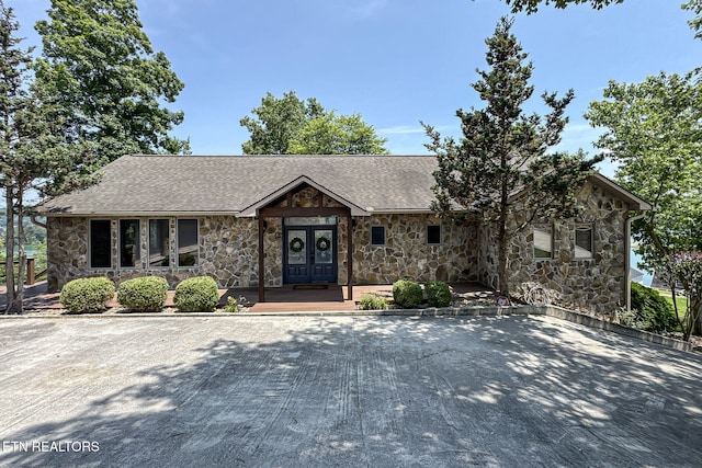 226 Mountain Crest Dr, Lafollette, TN 37766 - view of front of house featuring stone siding and a shingled roof