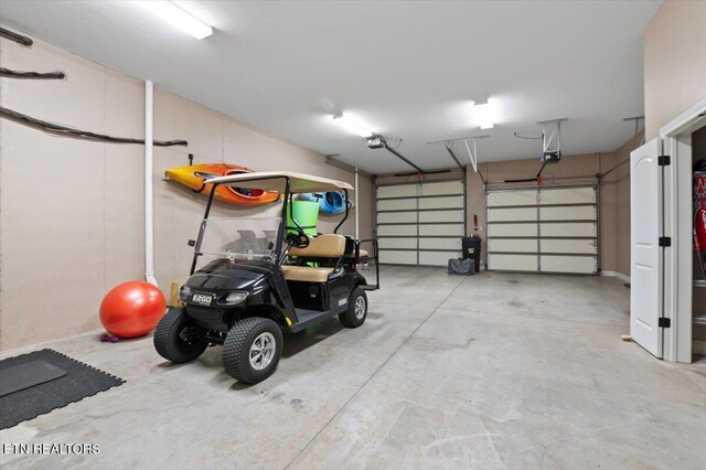 140 Broadleaf Ln Unit 100, Caryville, TN 37714 - garage featuring a garage door opener