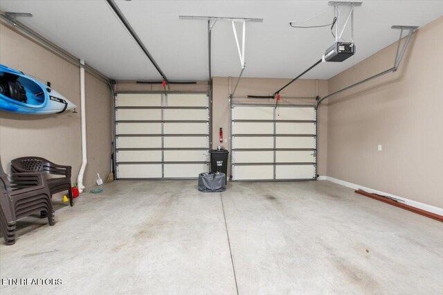 140 Broadleaf Ln Unit 100, Caryville, TN 37714 - garage featuring a garage door opener
