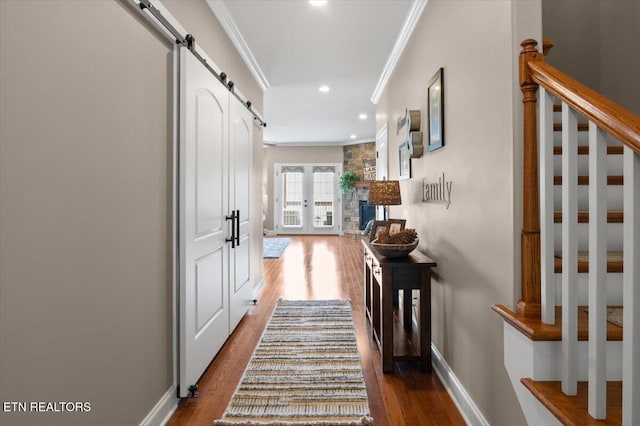 140 Broadleaf Ln Unit 100, Caryville, TN 37714 - hall with ornamental molding, dark wood-style floors, stairs, a barn door, and recessed lighting