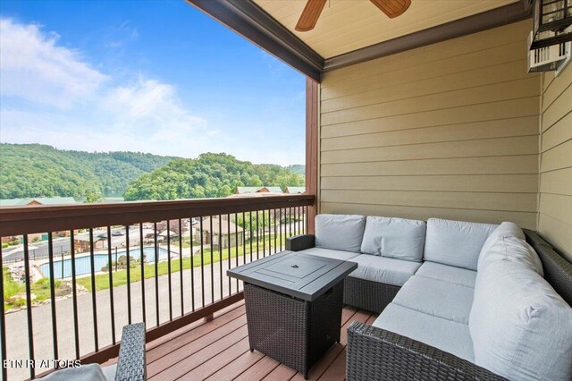 140 Broadleaf Ln Unit 100, Caryville, TN 37714 - balcony with outdoor lounge area, ceiling fan, view of pool area, and a view of trees