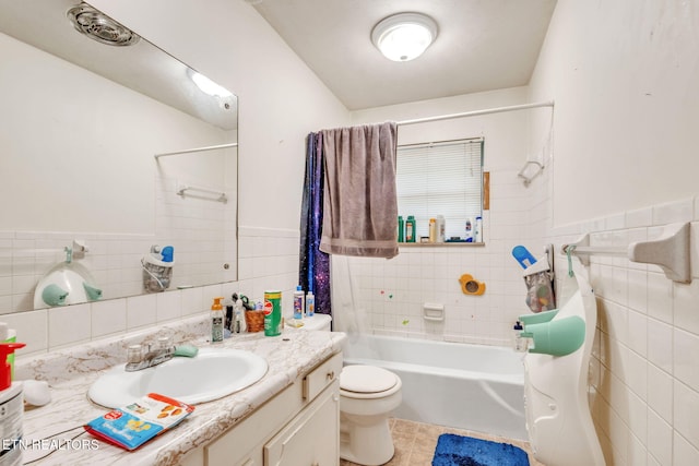 3413 N Fountaincrest Dr, Knoxville, TN 37918 - full bathroom featuring tile walls, vanity, tile patterned flooring, a wainscoted wall, and shower / tub combination