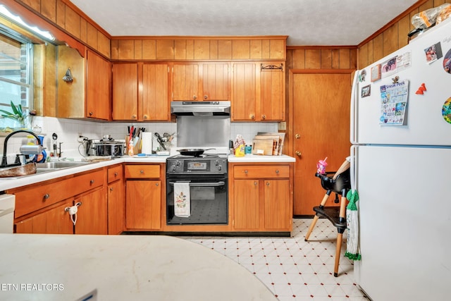 3413 N Fountaincrest Dr, Knoxville, TN 37918 - kitchen with white appliances, under cabinet range hood, light countertops, and light flooring