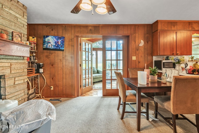 3413 N Fountaincrest Dr, Knoxville, TN 37918 - dining room with a ceiling fan, wood walls, and carpet