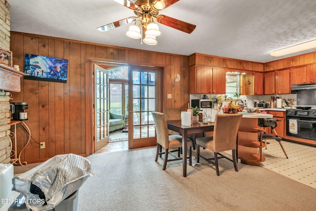 3413 N Fountaincrest Dr, Knoxville, TN 37918 - dining space featuring wooden walls, a ceiling fan, and light flooring