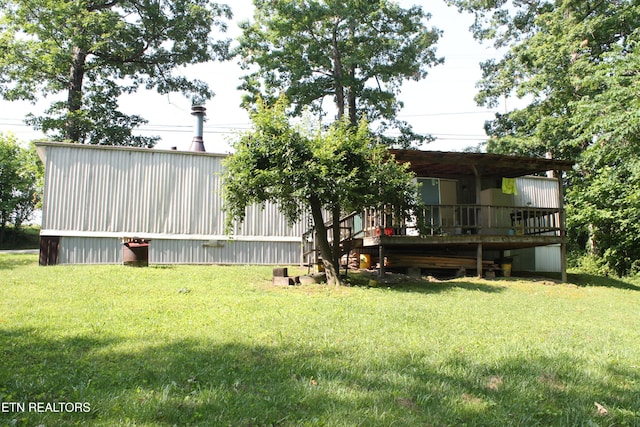 2122 Pickett Park Hwy, Jamestown, TN 38556 - view of grassy yard with a wooden deck