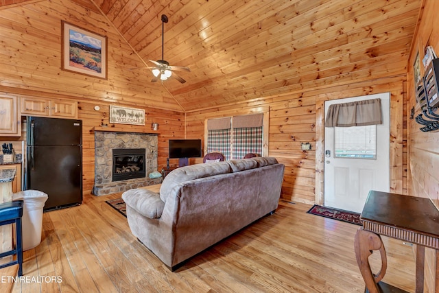 1528 Rainbow Ridge Way, Sevierville, TN 37862 - living room featuring light wood-type flooring, wooden walls, ceiling fan, wooden ceiling, and high vaulted ceiling