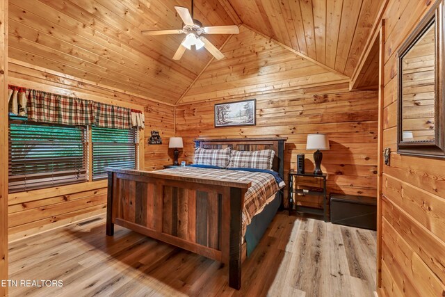 1528 Rainbow Ridge Way, Sevierville, TN 37862 - bedroom featuring lofted ceiling, wooden ceiling, wood walls, wood finished floors, and a ceiling fan