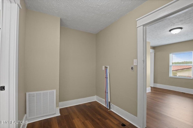 715 E Kentucky Ave, Lafollette, TN 37766 - washroom with a textured ceiling and wood finished floors