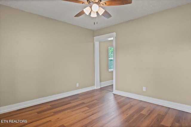 715 E Kentucky Ave, Lafollette, TN 37766 - empty room with wood finished floors and ceiling fan