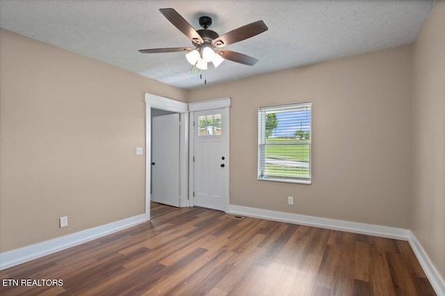 715 E Kentucky Ave, Lafollette, TN 37766 - unfurnished room featuring wood finished floors, a ceiling fan, and a textured ceiling