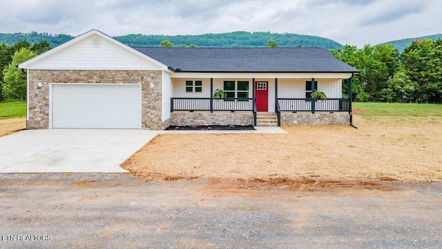 132 Galloway Airport Rd, Dunlap, TN 37327 - view of front facade with a porch, an attached garage, driveway, and stone siding