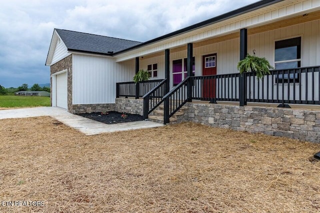 132 Galloway Airport Rd, Dunlap, TN 37327 - view of front facade featuring a porch, a garage, and roof with shingles