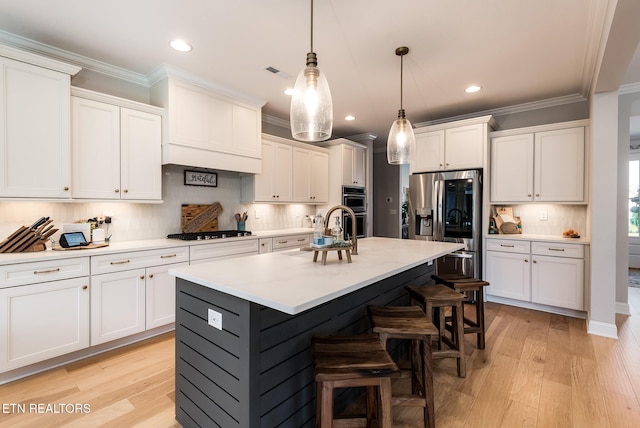 11914 Sandy Run Rd, Knoxville, TN 37934 - kitchen featuring gas cooktop, stainless steel fridge with ice dispenser, a breakfast bar, white cabinets, and ornamental molding