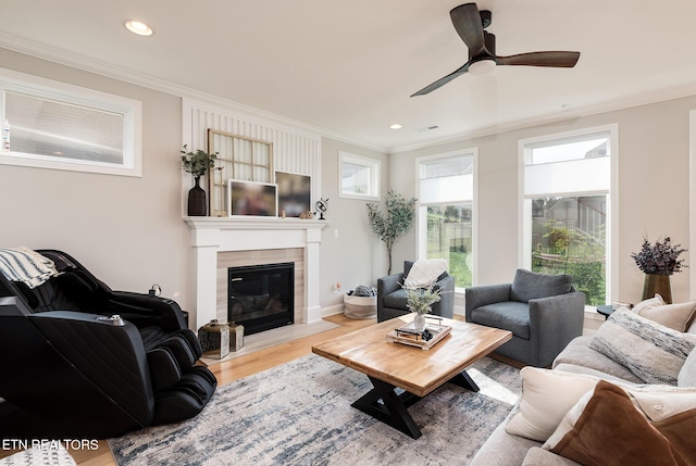 11914 Sandy Run Rd, Knoxville, TN 37934 - living area with crown molding, wood finished floors, recessed lighting, ceiling fan, and a tiled fireplace
