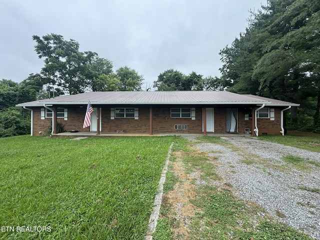 1637 Jefferson St, Morristown, TN 37814 - single story home featuring driveway, a front yard, a metal roof, and brick siding