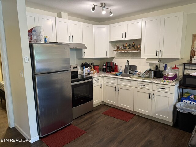 1637 Jefferson St, Morristown, TN 37814 - kitchen with stainless steel appliances, dark wood-type flooring, and white cabinetry