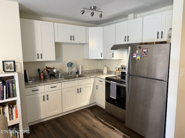 1637 Jefferson St, Morristown, TN 37814 - kitchen with appliances with stainless steel finishes, dark wood-style floors, and white cabinets
