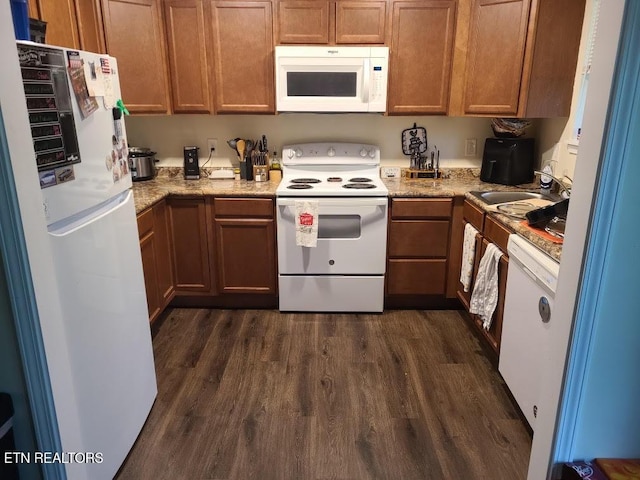 1637 Jefferson St, Morristown, TN 37814 - kitchen featuring white appliances, dark wood-style flooring, and brown cabinets