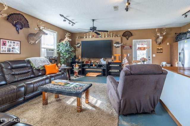 361 River Dr, Dunlap, TN 37327 - living area with track lighting, finished concrete floors, ceiling fan, a textured ceiling, and cooling unit