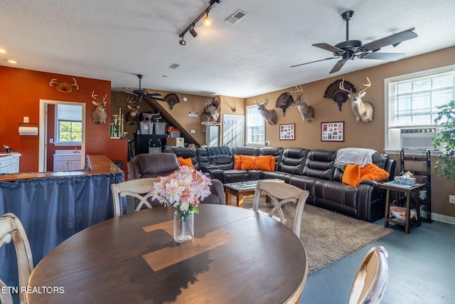 361 River Dr, Dunlap, TN 37327 - dining area featuring a ceiling fan, cooling unit, and a textured ceiling