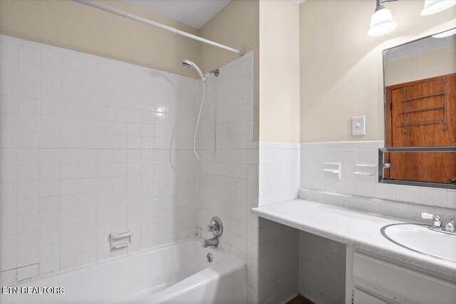 220 Lillywood Dr, Lafollette, TN 37766 - bathroom featuring washtub / shower combination, vanity, and tile walls