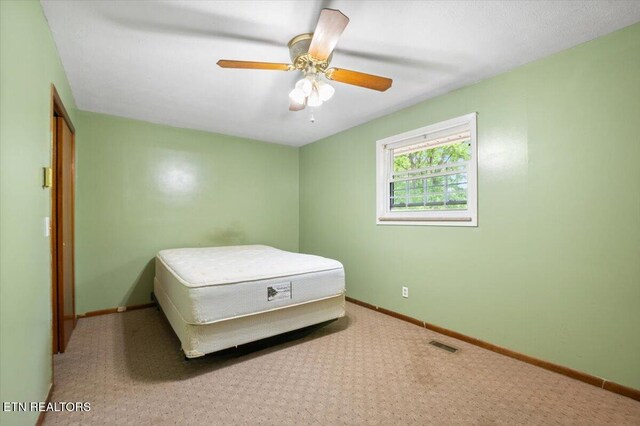 220 Lillywood Dr, Lafollette, TN 37766 - carpeted bedroom featuring baseboards and a ceiling fan