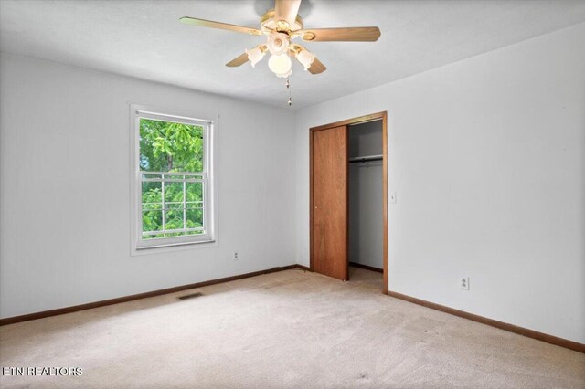 220 Lillywood Dr, Lafollette, TN 37766 - unfurnished bedroom with light carpet, a closet, and a ceiling fan