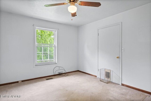 220 Lillywood Dr, Lafollette, TN 37766 - carpeted spare room with baseboards and a ceiling fan