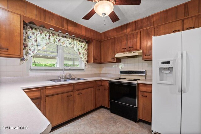 220 Lillywood Dr, Lafollette, TN 37766 - kitchen with white fridge with ice dispenser, range with electric stovetop, under cabinet range hood, and light countertops