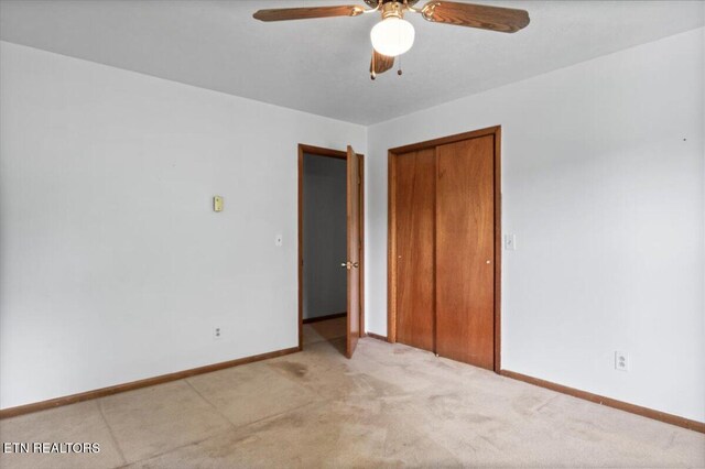220 Lillywood Dr, Lafollette, TN 37766 - unfurnished bedroom featuring light colored carpet, a closet, and a ceiling fan