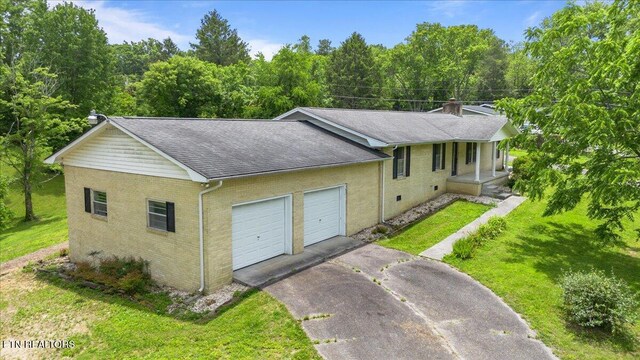 220 Lillywood Dr, Lafollette, TN 37766 - ranch-style home featuring a chimney, driveway, a garage, and a front yard