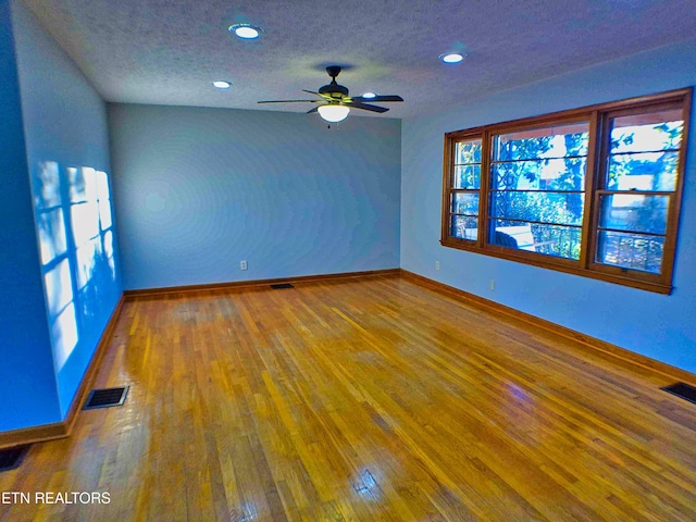 705 S 11th St, Lafollette, TN 37766 - empty room with a textured ceiling, hardwood / wood-style floors, a ceiling fan, and recessed lighting