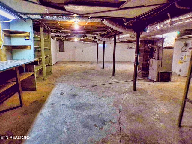 705 S 11th St, Lafollette, TN 37766 - unfinished basement with water heater and heating unit