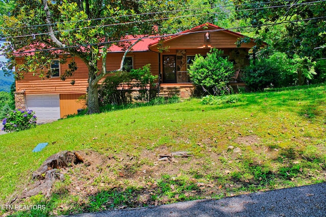 705 S 11th St, Lafollette, TN 37766 - view of front of house with an attached garage, a front lawn, driveway, and a metal roof