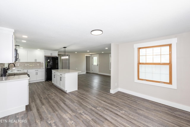 957 W Hunt Rd, Alcoa, TN 37701 - kitchen with black fridge with ice dispenser, a center island, open floor plan, light countertops, and recessed lighting