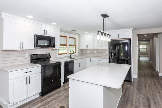957 W Hunt Rd, Alcoa, TN 37701 - kitchen featuring black appliances, dark wood-type flooring, plenty of natural light, white cabinetry, and recessed lighting