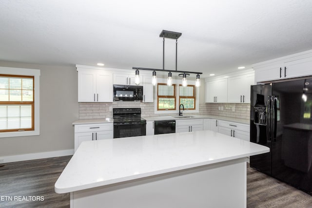 957 W Hunt Rd, Alcoa, TN 37701 - kitchen with black appliances, tasteful backsplash, light countertops, dark wood-type flooring, and recessed lighting